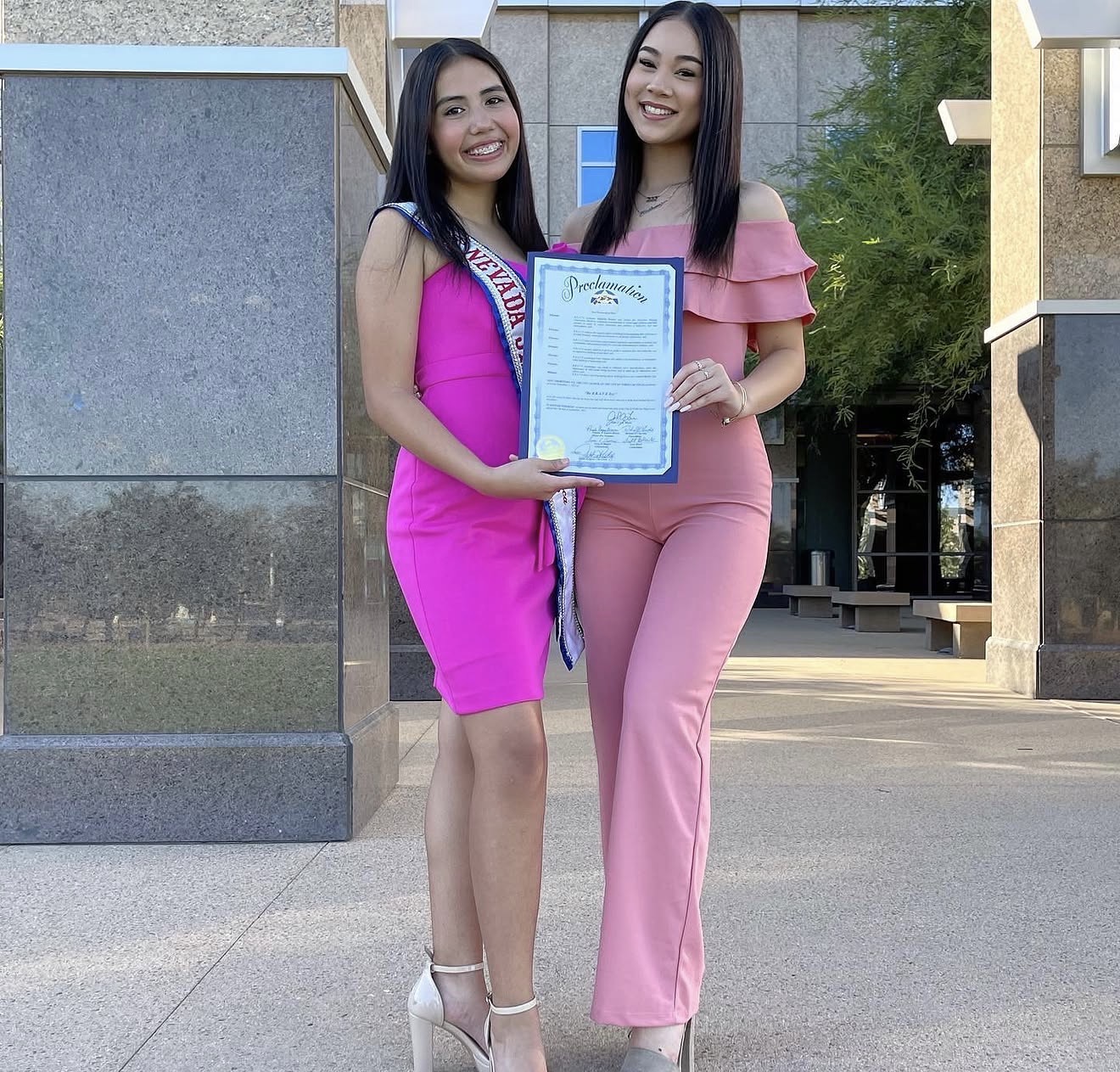 Aiyana Castro and Kailena Needham presenting a Be BRAVE Day proclamation