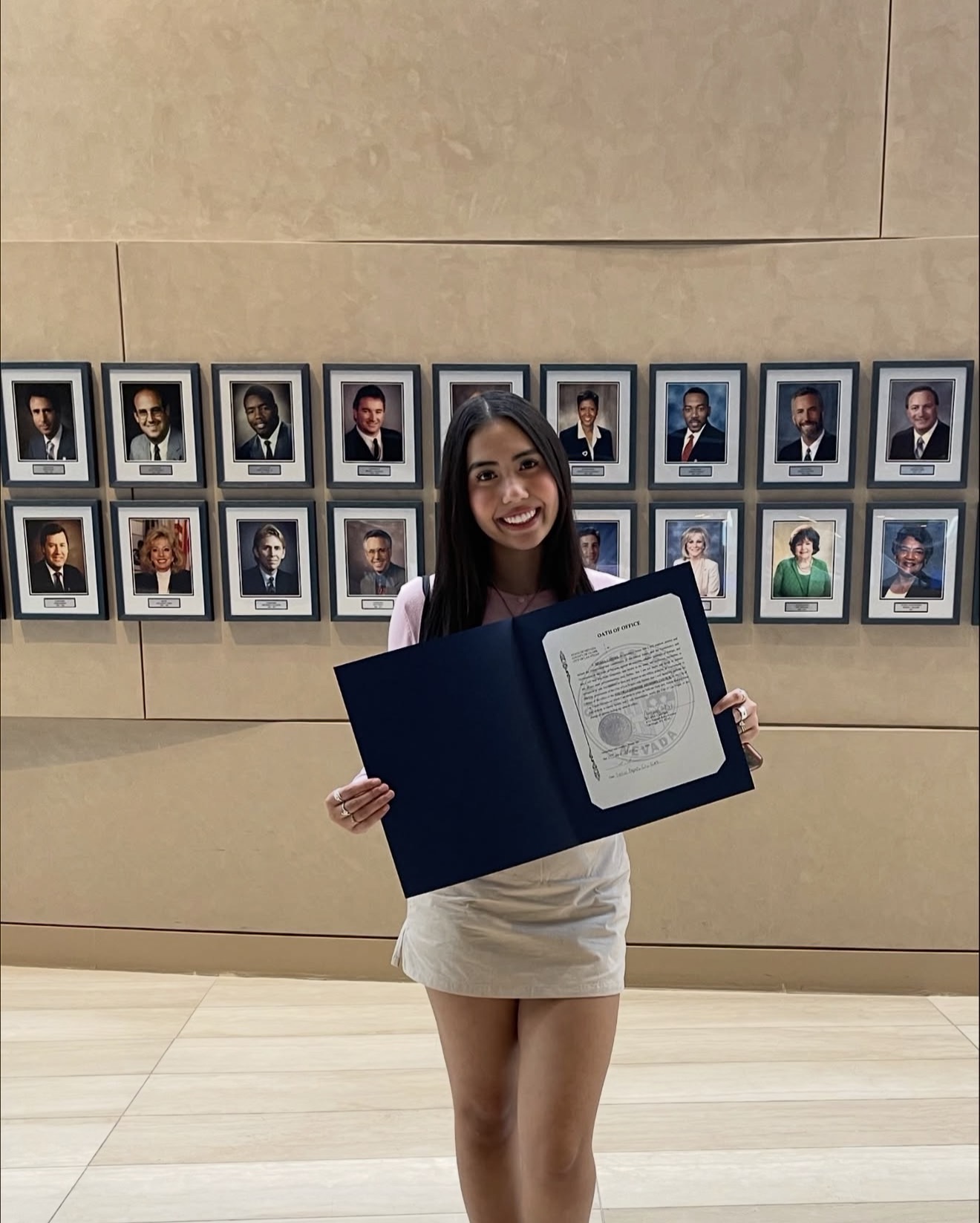 Aiyana Castro holding her official oath of office at Las Vegas City Hall
