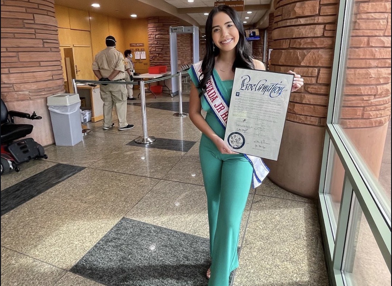 Aiyana Castro holding the Clark County Be BRAVE Day proclamation