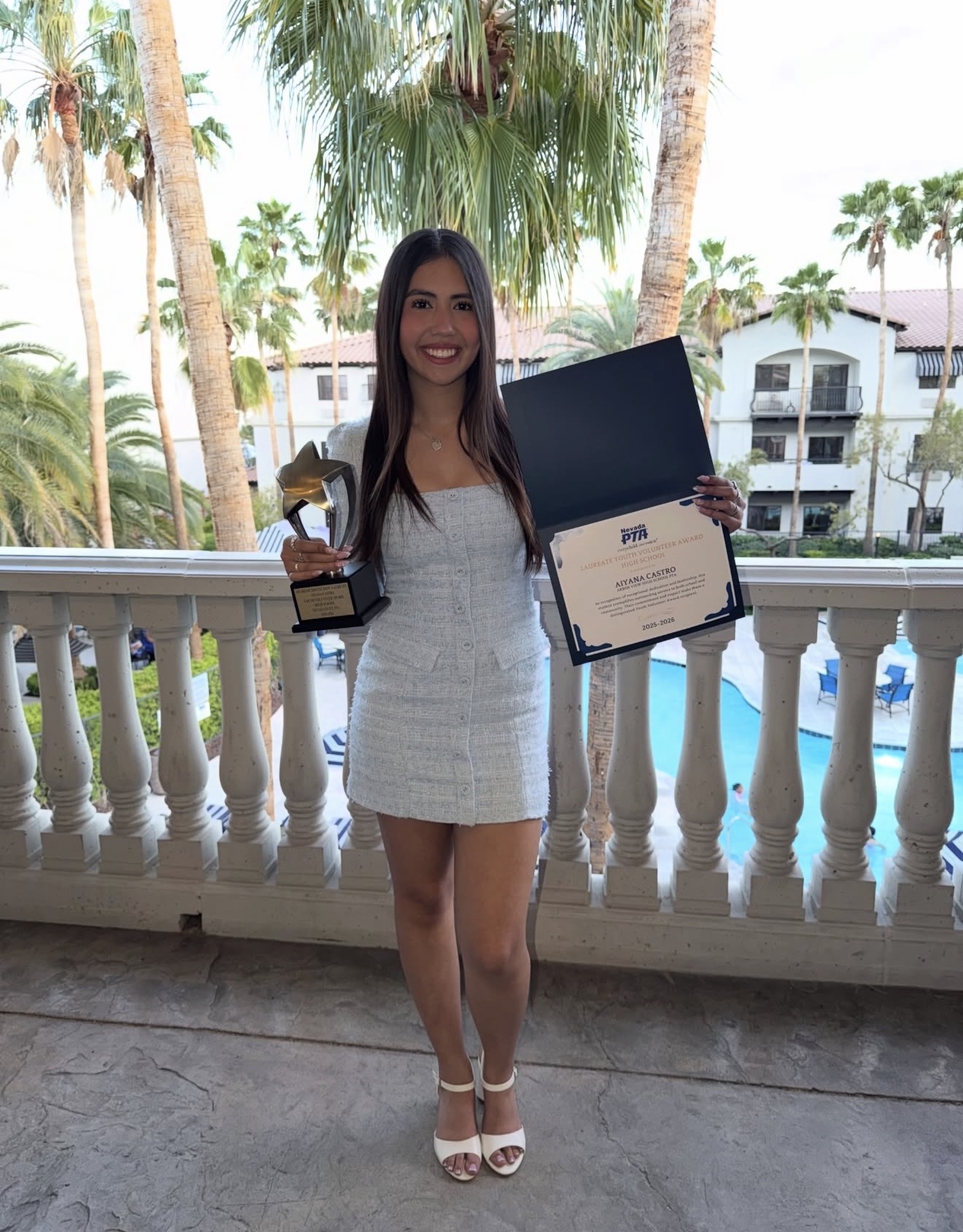 Aiyana Castro holding the Nevada PTA Laureate Youth Volunteer Award