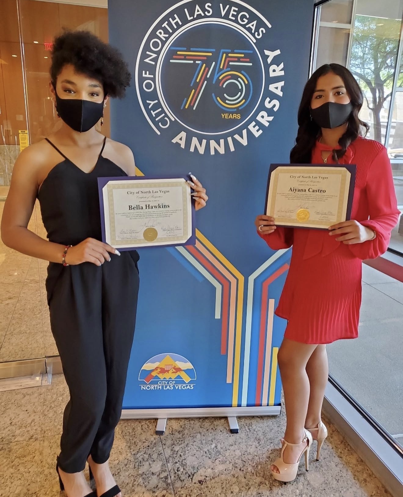 Aiyana Castro and Bella Hawkins holding City of North Las Vegas certificates