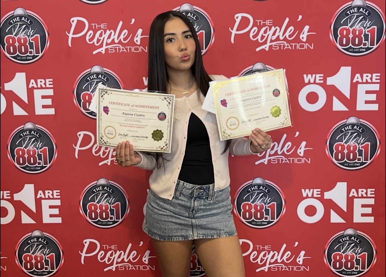 Aiyana Castro holding Teen Talk certificates at 88.1 The People's Station